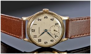 Garrard vintage 9ct gold cased gents manual wind wrist watch supported on a leather strap with a