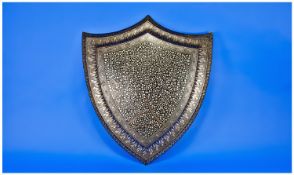 Islamic Shield Crest of Unusual Form, finely inlaid, with profusely intricate silver floral