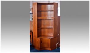 G Plan Teak Veneered Corner Unit, of concave form, fitted with three shelves, the base with single