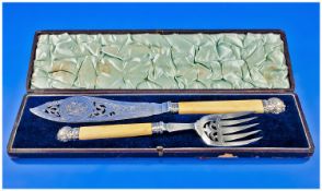 Edwardian good quality pair of large ornate and chased fish servers with bone handles. In original