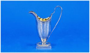 George 3rd silver helmet shaped cream jug with bright cut foliate engraving. London 1786 153 grams.