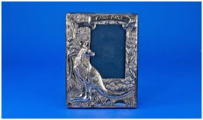 Australian Interest. An impressive silver photo frame featuring in relief a kangaroo amongst native