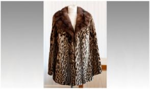 Ocelot and Mid Brown Mink Jacket, the mink collar with revers, slit pockets, half belt to back with