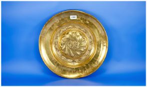 An Antique Nuremburg Style Brass Alms Dish, the central Roundell embossed with a rampant lion. 16``