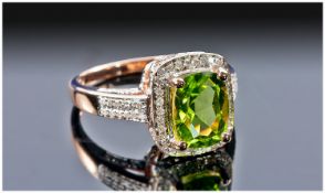 14ct Rose Gold Diamond Peridot Ring, Set With An Cushion Cut Peridot, (Approx 3.20cts) Surrounded