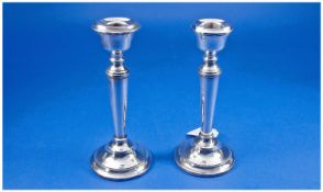 A Silver Classical Style Pair of Candlesticks. Hallmarked Birmingham 1963. Loaded bases. Each 6.25