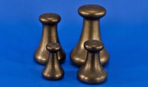 Set of Four Avery Brass Dump Weights comprising 7, 4, 2 and 1 Pound Weights.
