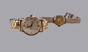 Gents 9ct Gold Accurist Wristwatch, Manual Wind, 33mm Case, Plated Expandable Bracelet Strap.