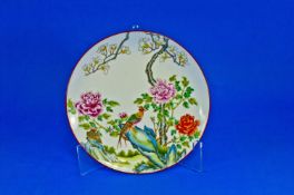 A Chinese Famille Rose Decoration Plate, marks to the back in red. 9.2 inches diameter.