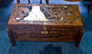 Small Oriental Hardwood Camphor Chest, with an elaborate carved top, with glass cover, carved