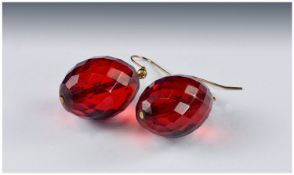 Pair of Red Faceted Amber Earrings, each large, translucent oval drop 1 inch long, plus shepherd`s