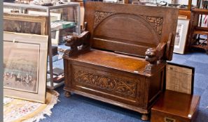 Early 20th Century Oak Monks Bench, circa 1930, raised and fielded panel to top, arched shaping to