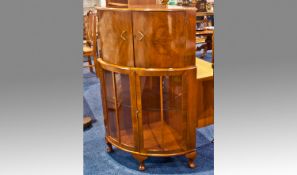 Early 20th Century Mahogany Cocktail Cabinet, the lower section with a glazed door, 48 inches high,