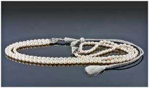 Triple Strand Ivory White Cultured Baroque Pearl Necklace, the three graduated strands held in line