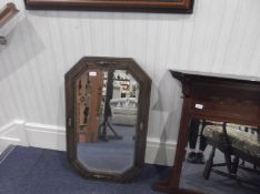 Jacobean Style Oak Framed Mirror, of oblong hexagonal form, fitted with bevelled edge glass.