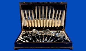 Oak Cased Canteen of Cutlery, the cutlery of stainless steel comprising 12 knives, early twentieth