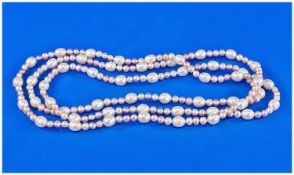 Pale Peach and White Cultured Freshwater Pearl Sautoir, 48 inch long rope of oval white pearls each