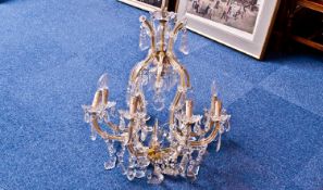 Large Eight Branch Glass Chandelier, complete with cut glass faceted droplets, with a cross section