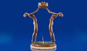Art Deco Period Decorative Bronzed Metal Figural Table Lamp with the figures of two semi-clad women