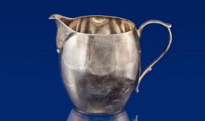 Small Sterling Silver Cream Jug, hallmarked for London 1939, measuring 2½ inches high.