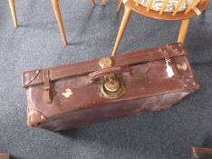 Leather Suitcase with heavy brass lock mechanism.