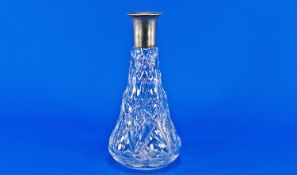 Early 20th Century Cut Glass Decanter, with silver plated collar to neck, diamond cut top, faceted