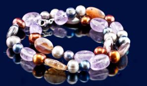 A Necklace of Natural Amethyst, Agate and Blue, Brown and Silver Cultured Pearls. Silver clasp.