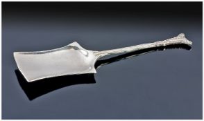 An Arts and Crafts Silver Caddy Spoon of shovel shape with a beaded handle. Marked silver with a