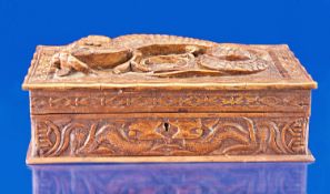 Small Oriental Hardwood Box, carved to front with a Dragon in high relief, 20th century.