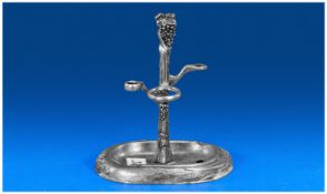 Pewter Wine Accoutrements Stand, three holders for corkscrew etc.,the stem topped with moulded