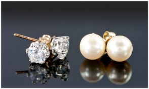Two Pairs Of 9ct Gold Stud Earrings.