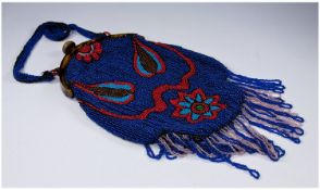 Ladies Handbag with tortoiseshell style clasp, beaded decoration in blue & red & tassels to base.