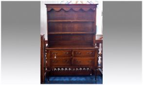 George II Style Oak Dresser and Rack, the rack with two shelves, raised on base comprising four