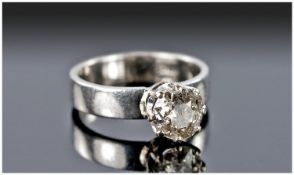 A Single Stone Diamond set in an 18 Carat Gold Shank, approx 1 carat. Modern setting. Stamped 18