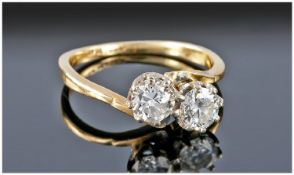 18ct gold and platinum two stone diamond crossover ring. Est. weight 1.30 cts circa 1920`s.