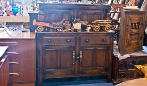 Ercol Oak and Elm Jacobean Style Cupboard, in the form of a court cupboard, fitted with two two-