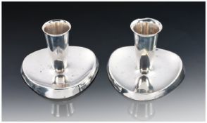 A Pair of Stylish Dwarf Silver Candlesticks. Rounded triangular bases with spreading trumpet