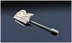 A Sterling Silver Rolls Royce Lapel Pin designed as the `RR` Insignia. Marked sterling and with a