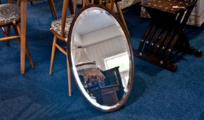 Oval Oak Mirror with bevelled glass and beaded edge.