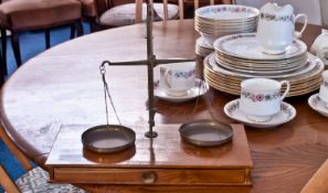 Small Set of Indian Balance Scales, metal, on a rectangular wooden base with drawer holding a part