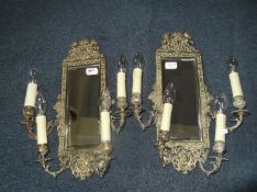 Pair of Art Nouveau Brass Mirror Backed Wall Candle Lights, circa 1900, the frames cast with