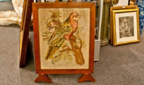 Woolwork Parrot Firescreen, depicting the bird on a tree branch. 28x23``. Circa 1860/80.