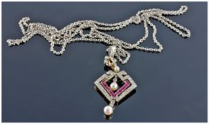 Art Deco Platinum and Gold, Rubies and Diamond Set Pearl Pendant Drop. Supported on a long platinum