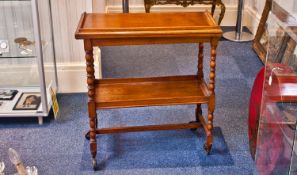 An Early Twentieth Century Oak Two Tier Trolley, the top folding. 30 inches high.