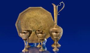 Eastern Brass Ewer, Tray And Five Matching Goblets. Profusely Chased Throughout, Early 20thC,