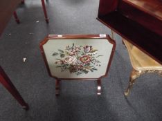 Mahogany Folding Fire Screen, the top lifting up and forming a table, the panel with woolwork