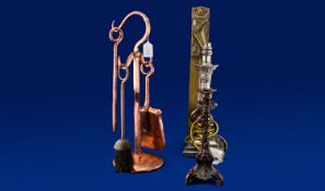 Small Copper Fireside Companion Set, together with a naturalistic spelter candlestick an Art