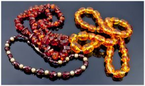 Three Various Amber Coloured Necklaces, one 30 inches long, one graduated 27 inches long and one