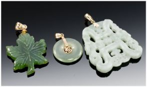 Three Jade Coloured Pendants, All With Gold Mounts And Bale.