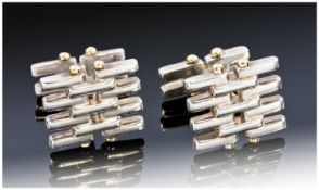 Tiffany and Co. A quality pair of silver and 18 carat gold cufflinks. Silver grid design with gold